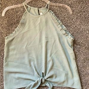 Mine, size small, sage green (richer in color in person) polyester blouse.